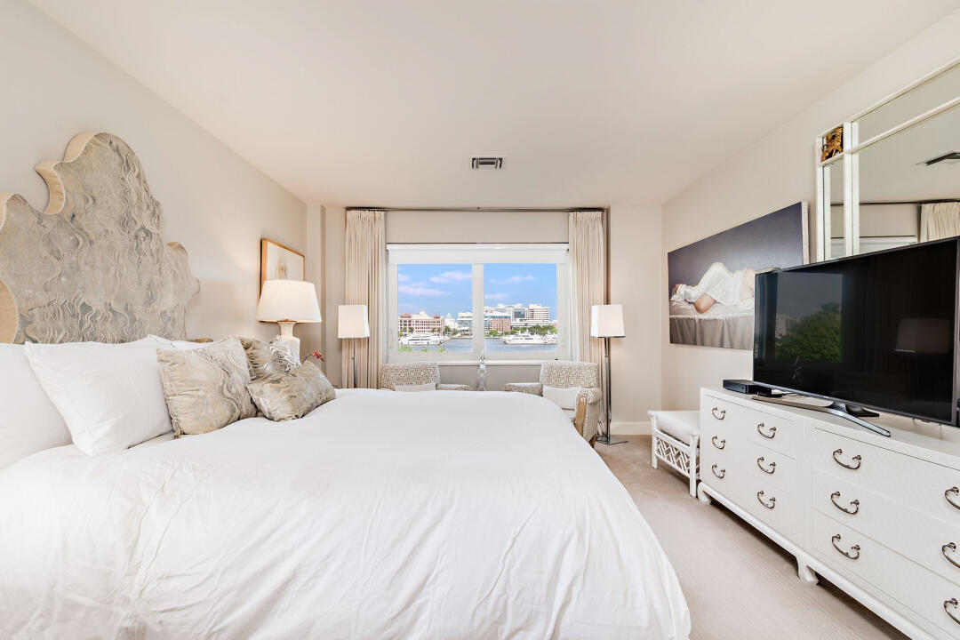 44 Cocoanut Row, Unit 320B Palm Beach, FL 33480 - Photo 8 of 27 a bedroom with a bed and a flat screen tv