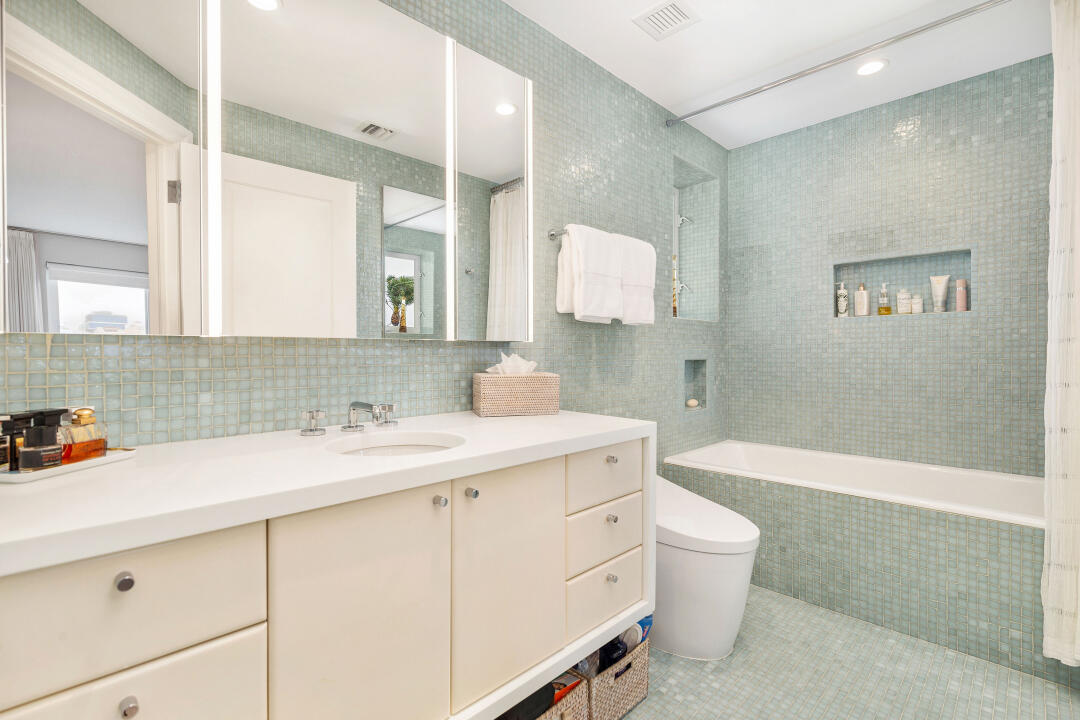 44 Cocoanut Row, Unit 320B Palm Beach, FL 33480 - Photo 10 of 27 a bathroom with a sink toilet vanity and shower