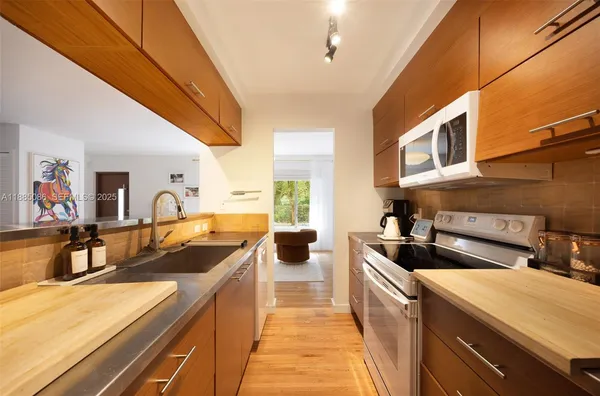 a kitchen that has a sink and a stove