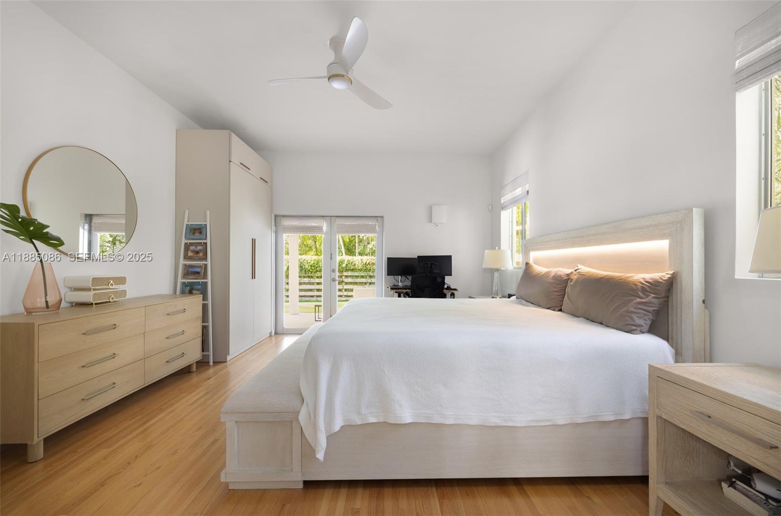 3894 Main Highway Miami, FL 33133 - Photo 21 of 24 a bedroom with a bed and a dresser