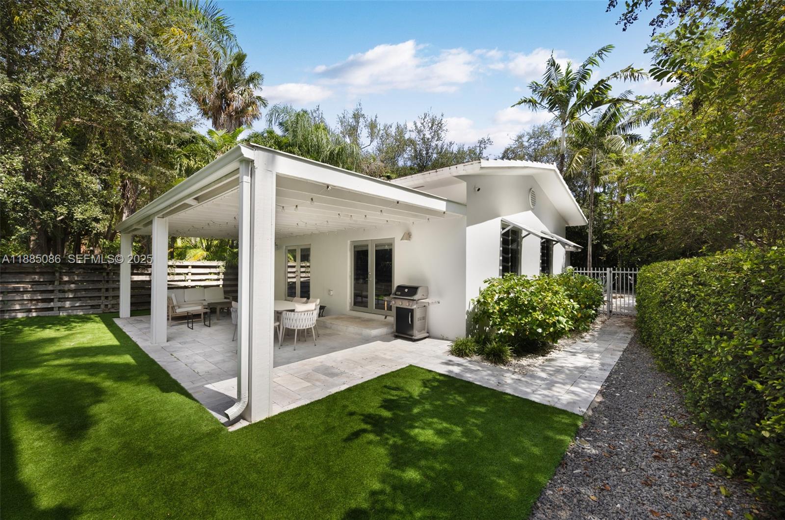 3894 Main Highway Miami, FL 33133 - Photo 5 of 24 a front view of a house with a yard