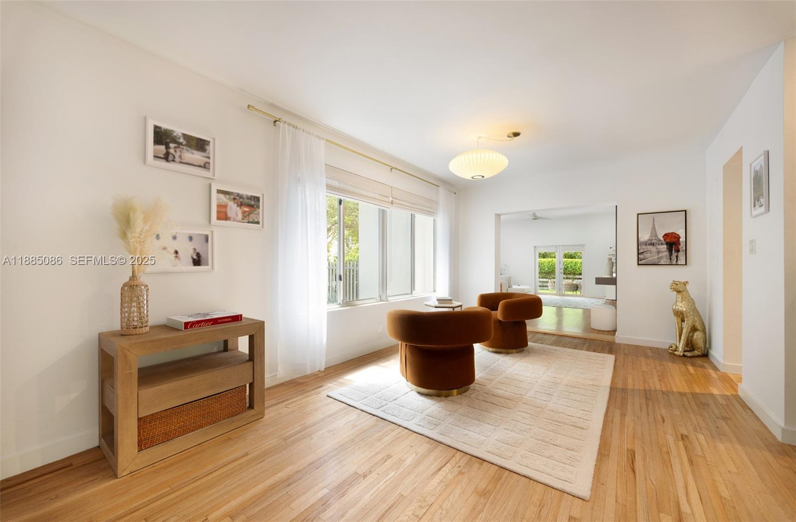 3894 Main Highway Miami, FL 33133 - Photo 8 of 24 a living room with furniture and a wooden floor