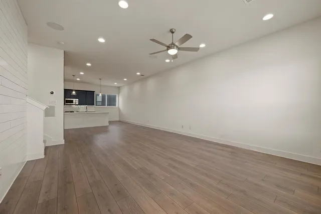 a view of a kitchen with a sink and a stove top oven
