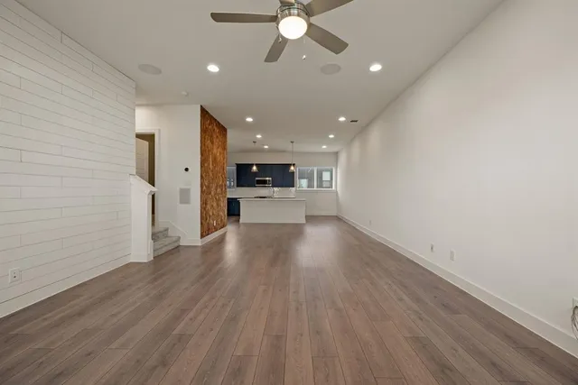 a view of a kitchen with a sink and a stove top oven