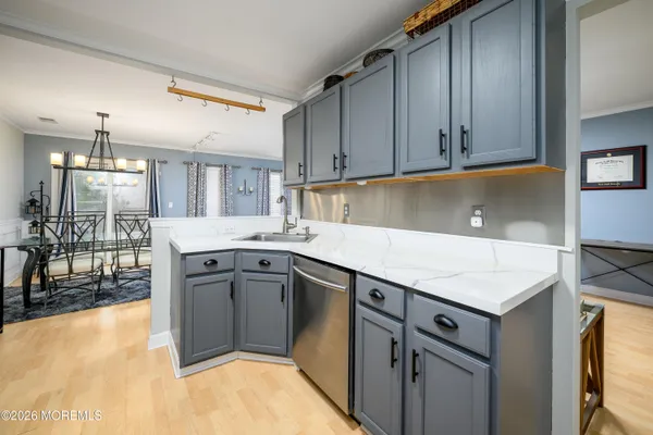 a view of a dining room with furniture wooden floor and a clock