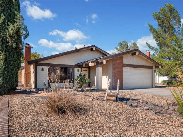 a patio with a table and chairs
