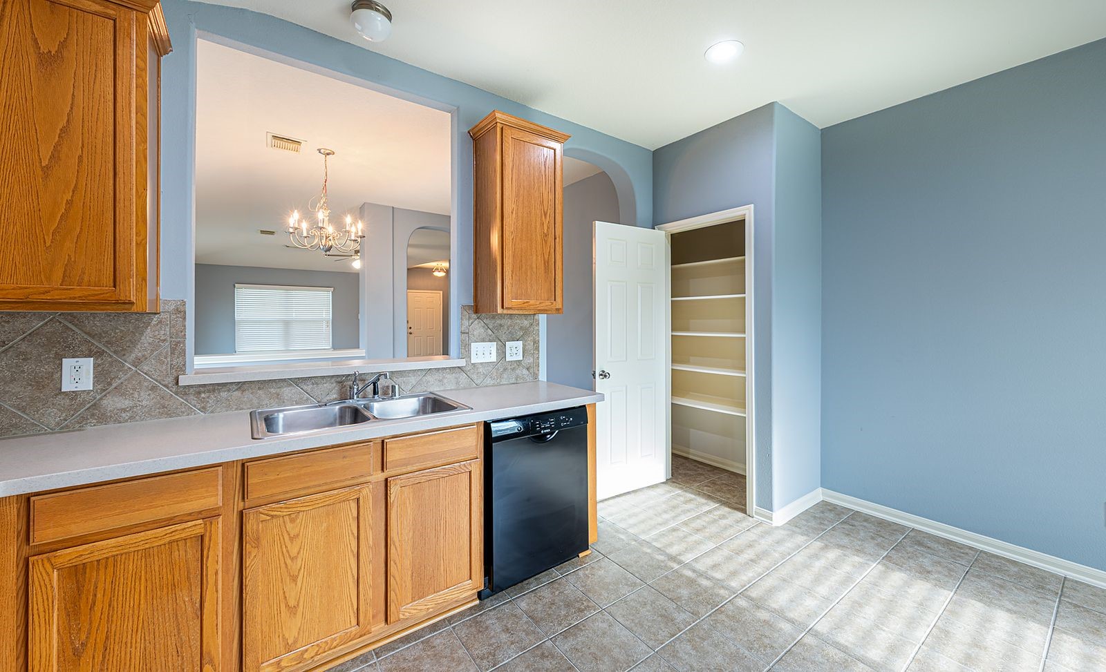22715 Imperial Ivy Court Spring, TX 77373 - Photo 25 of 33 a bathroom with a granite countertop sink and a mirror