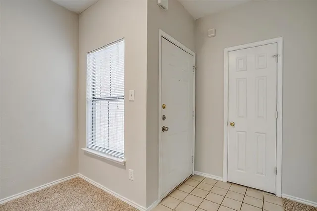 a view of an empty room with window