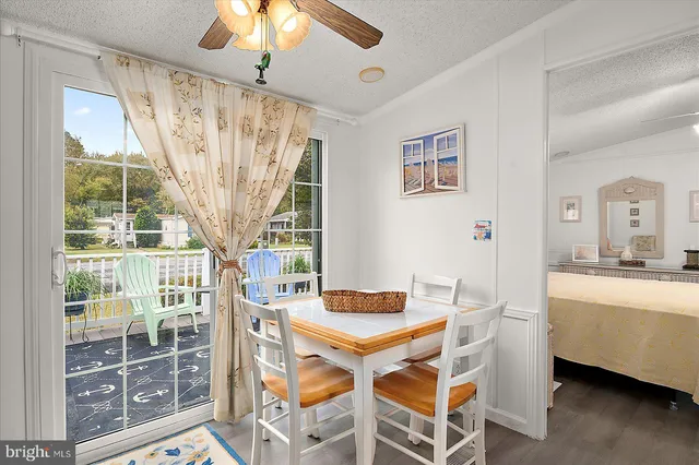 a bedroom with a bed and glass walk in closet