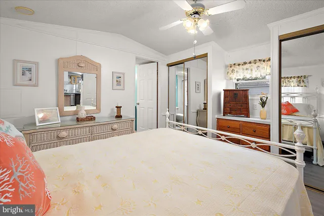 a bedroom with furniture and a chandelier