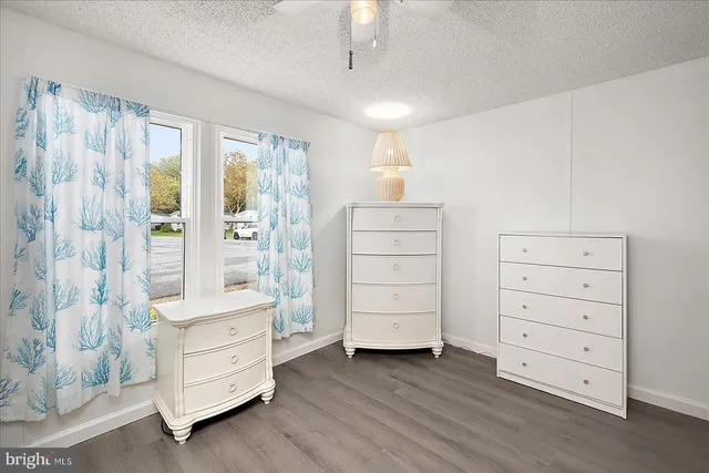 a bathroom with a sink toilet and mirror