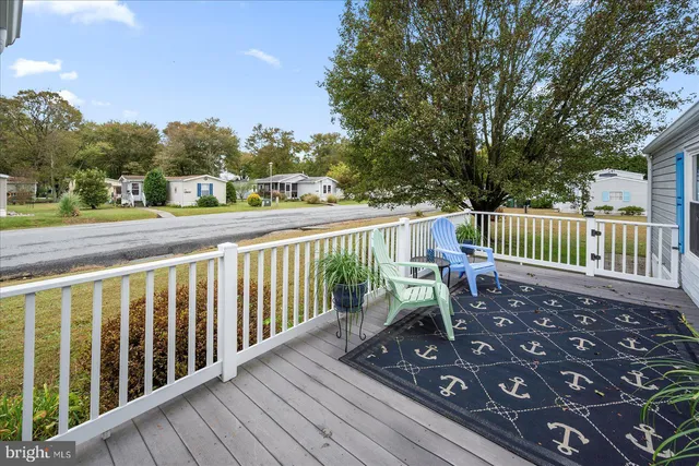 a view of a swimming pool with a table and chairs