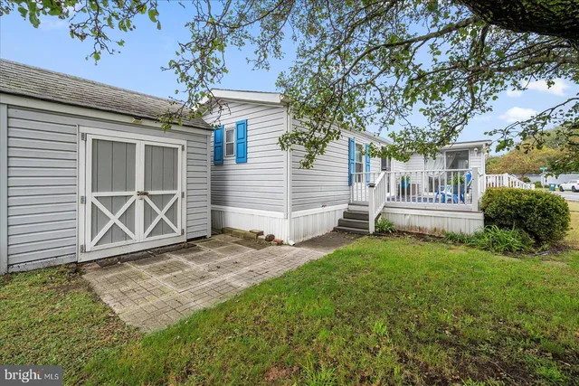 a view of a swimming pool with a table and chairs