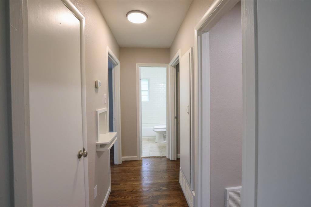 427 Daniel Street Richardson, TX 75080 - Photo 4 of 8 a view of a hallway with wooden floor