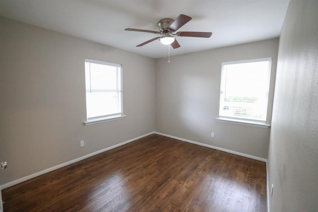 427 Daniel Street Richardson, TX 75080 - Photo 7 of 8 wooden floor in an empty room with a window