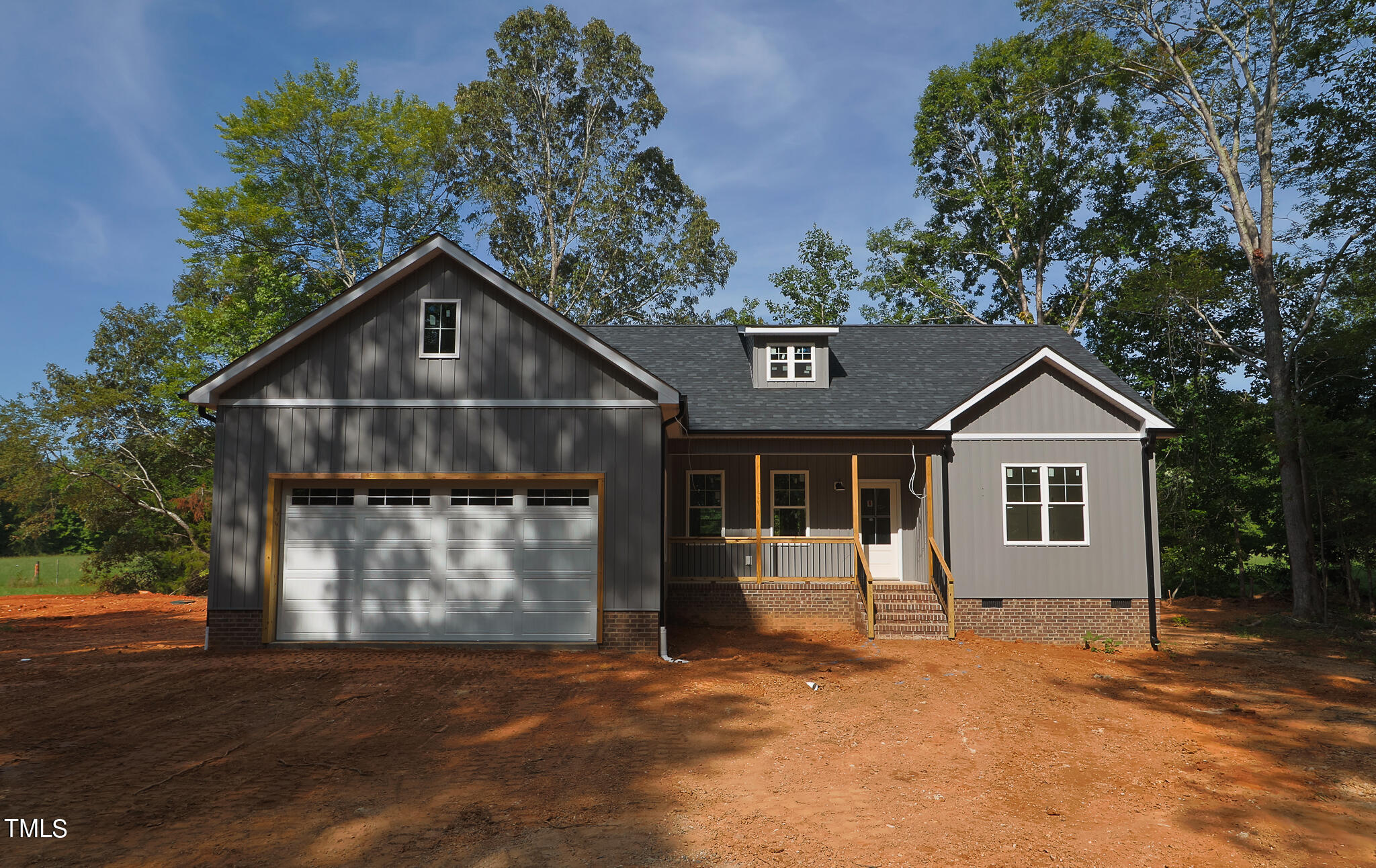9550 Meredith Drive Rougemont, NC 27572 - Photo 1 of 32 a front view of a house with a yard and garage