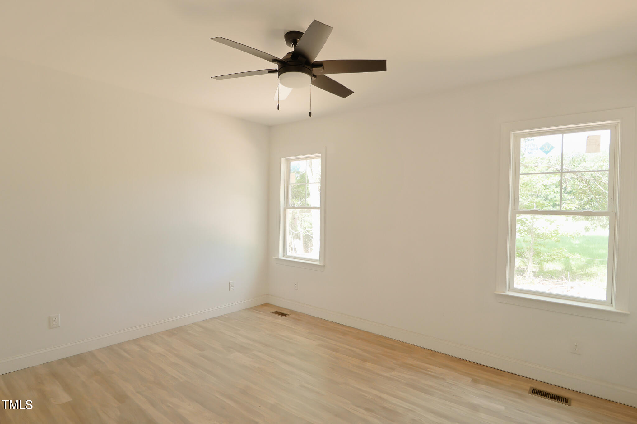 9550 Meredith Drive Rougemont, NC 27572 - Photo 16 of 32 an empty room with a window and a fan
