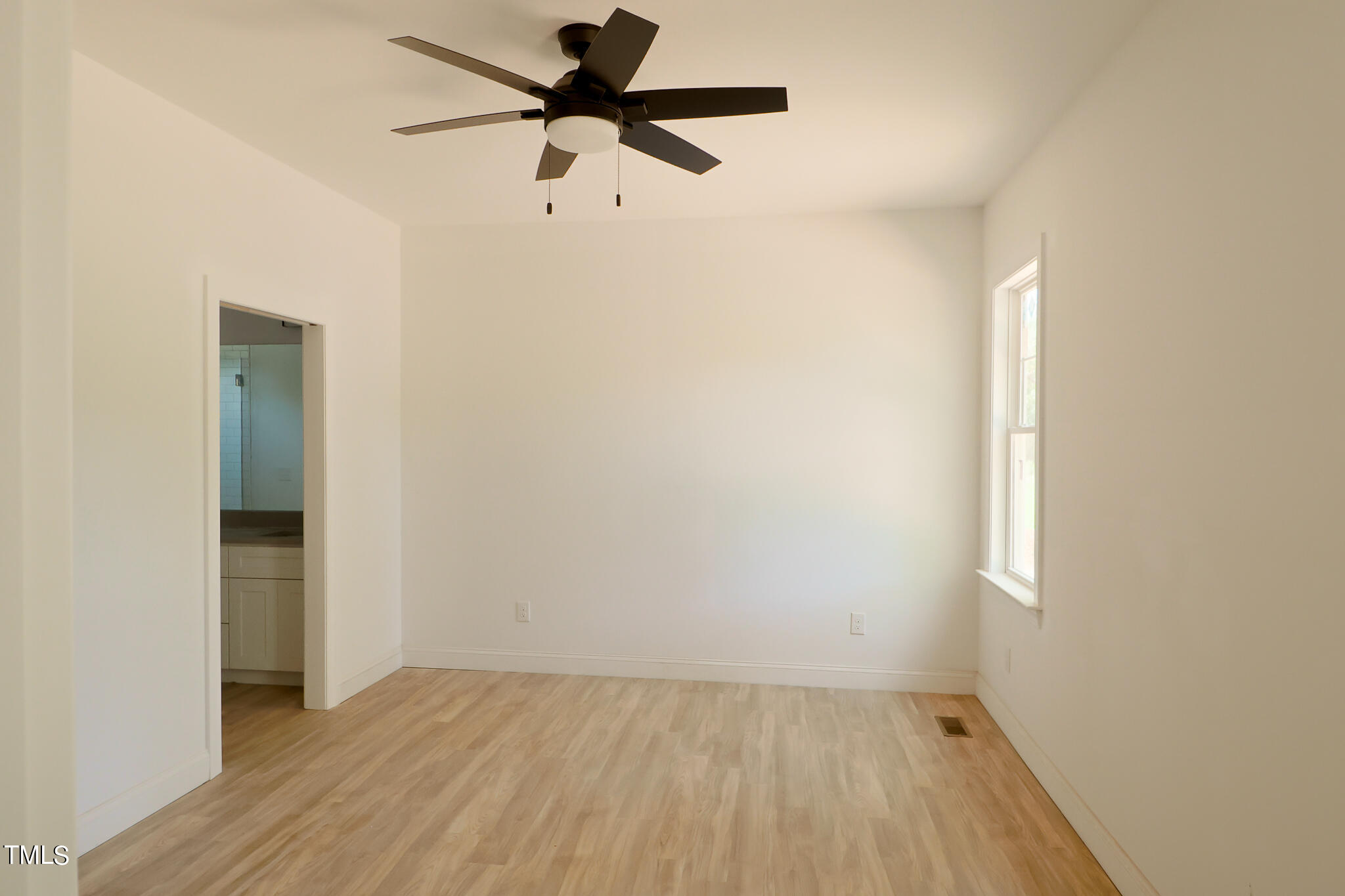 9550 Meredith Drive Rougemont, NC 27572 - Photo 17 of 32 an empty room with a window and a fan