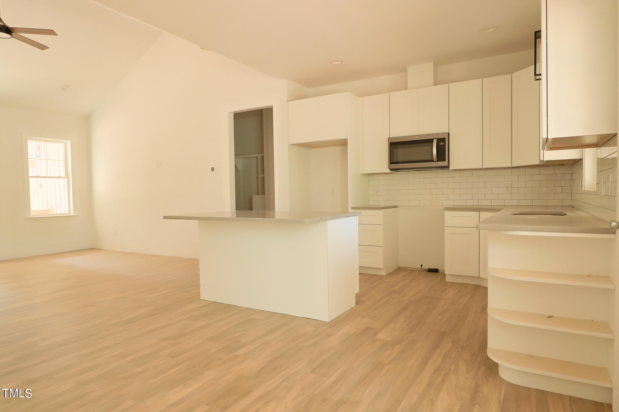 9550 Meredith Drive Rougemont, NC 27572 - Photo 25 of 32 a view of a kitchen with wooden floor and a sink