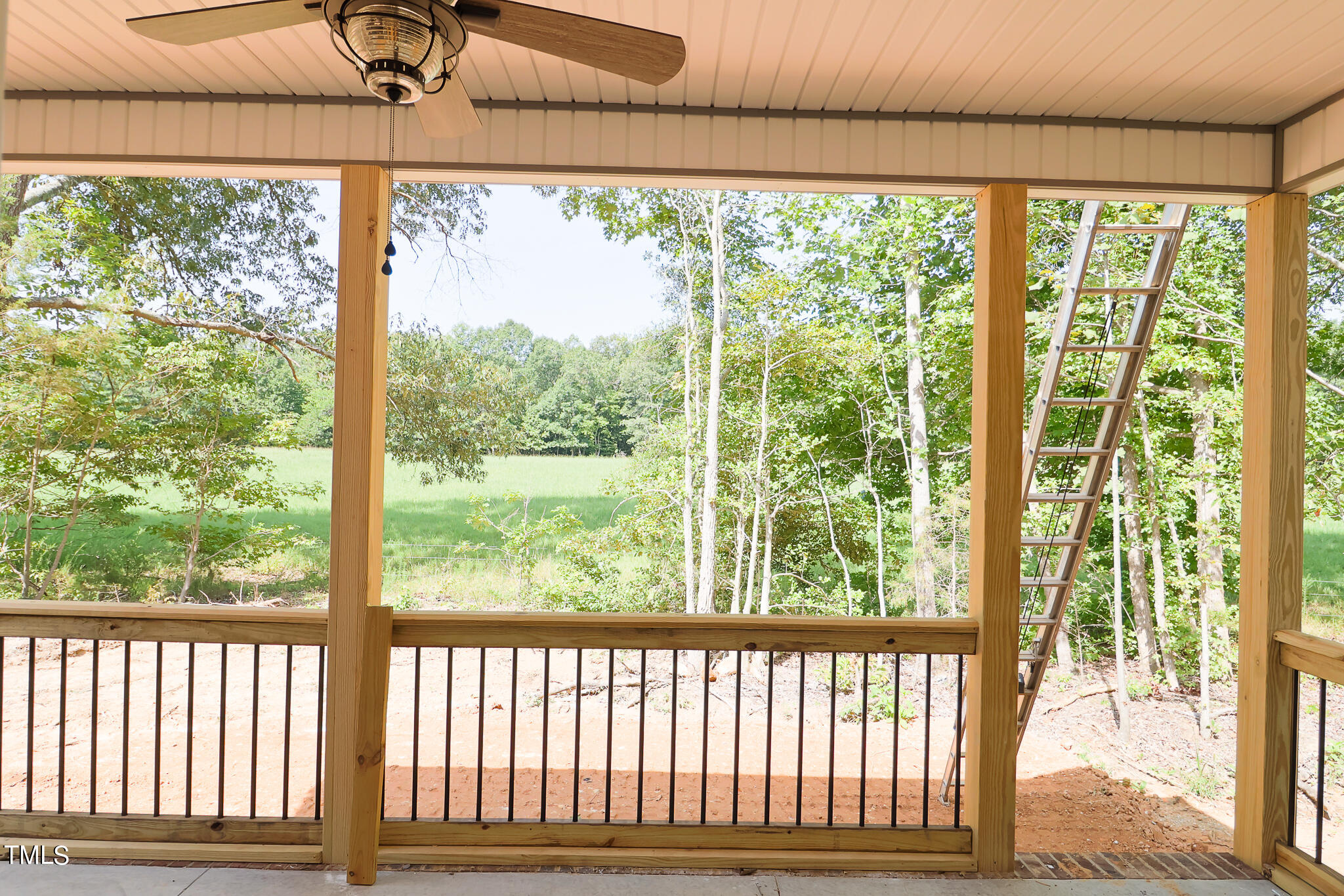 9550 Meredith Drive Rougemont, NC 27572 - Photo 28 of 32 a view of a porch with a floor to ceiling window and outside view
