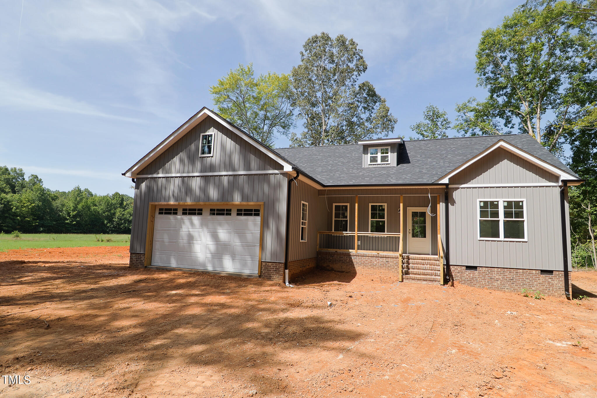 9550 Meredith Drive Rougemont, NC 27572 - Photo 32 of 32 a front view of a house with a yard and garage