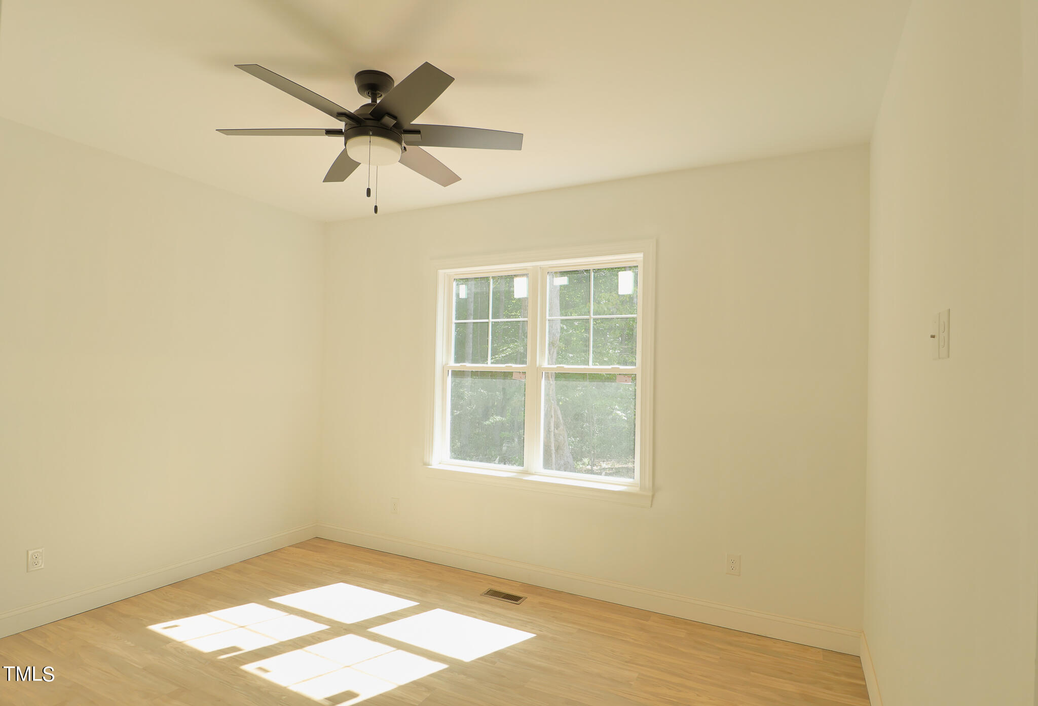 9550 Meredith Drive Rougemont, NC 27572 - Photo 9 of 32 an empty room with a window and a fan