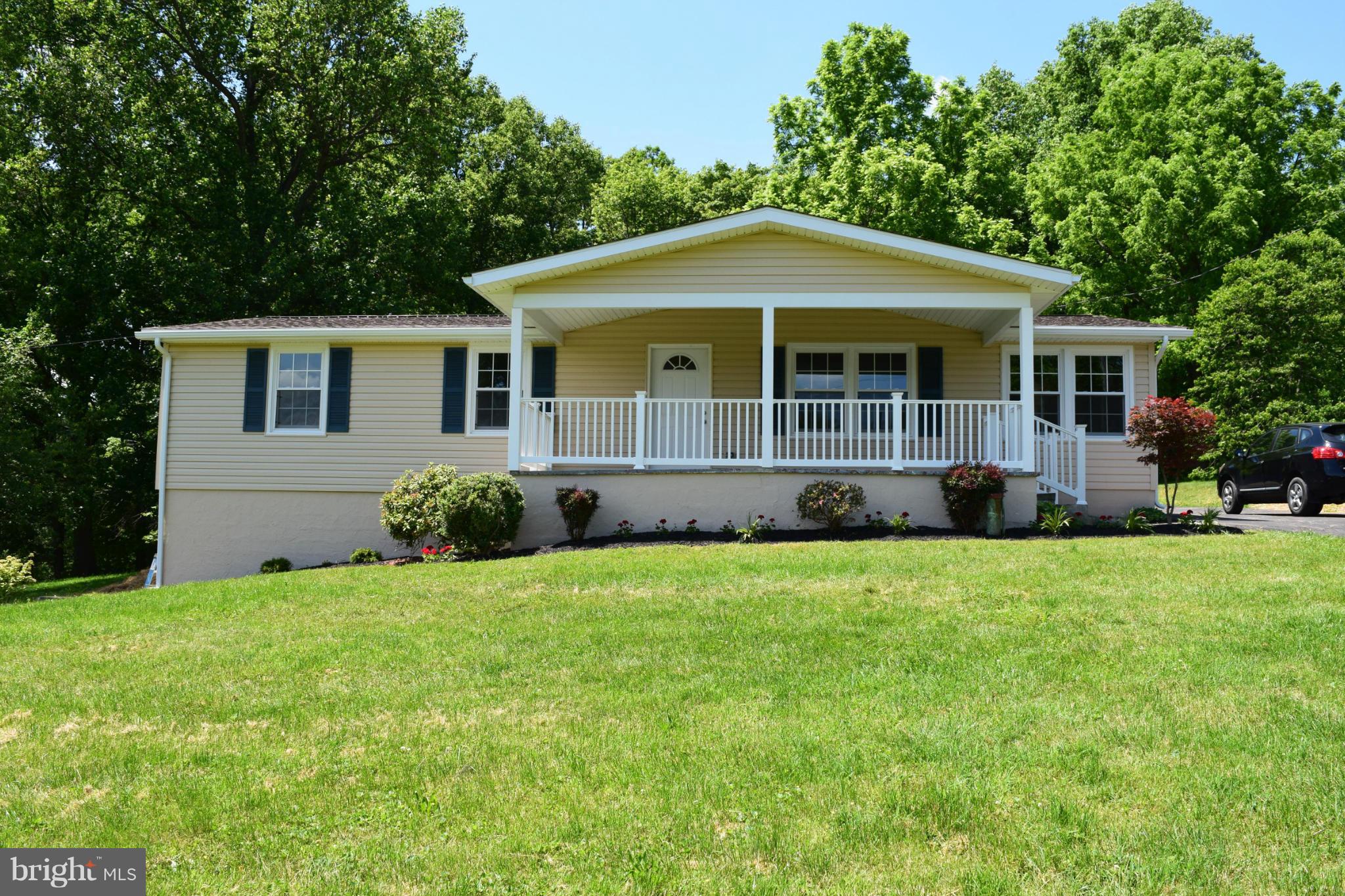4527 Mountville Road Frederick, MD 21703 - Photo 3 of 26 a front view of house with yard and green space