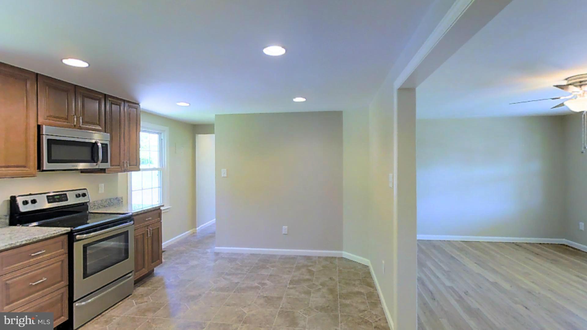 4527 Mountville Road Frederick, MD 21703 - Photo 8 of 26 a view of kitchen with microwave and cabinets