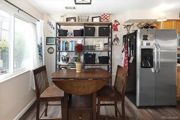 a kitchen with stainless steel appliances a sink and a refrigerator