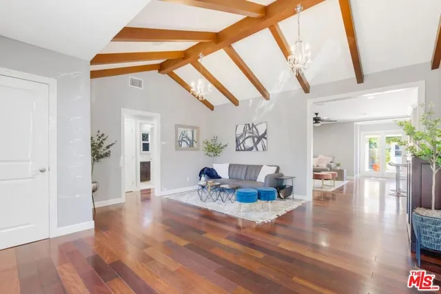 a living room with furniture and a table