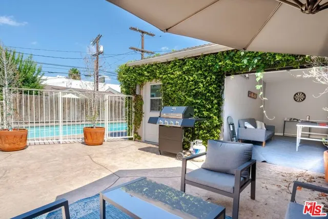 a room with a table and a wall painting