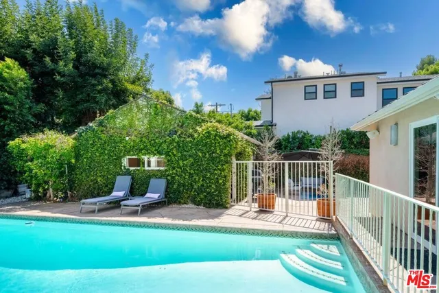 a house view with a seating space and garden view