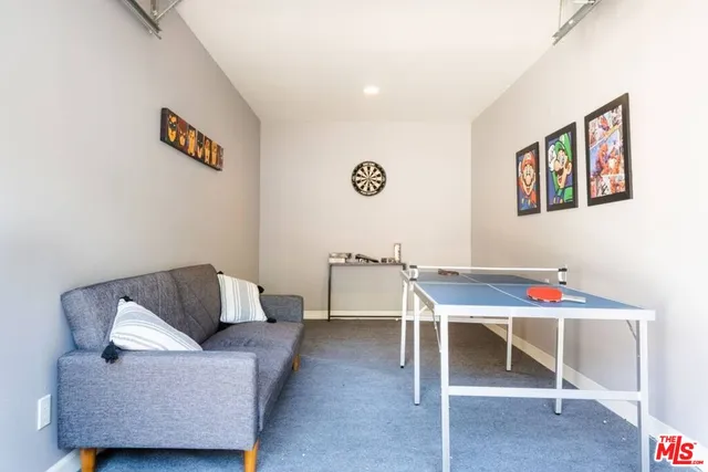 a bed room with furniture and wooden floor
