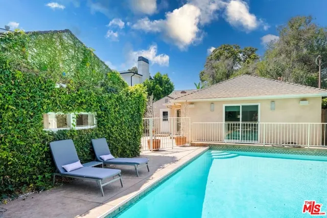 a kitchen with stainless steel appliances a sink stove and cabinets