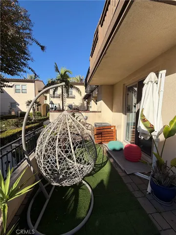 a view of roof deck with dining table and chairs