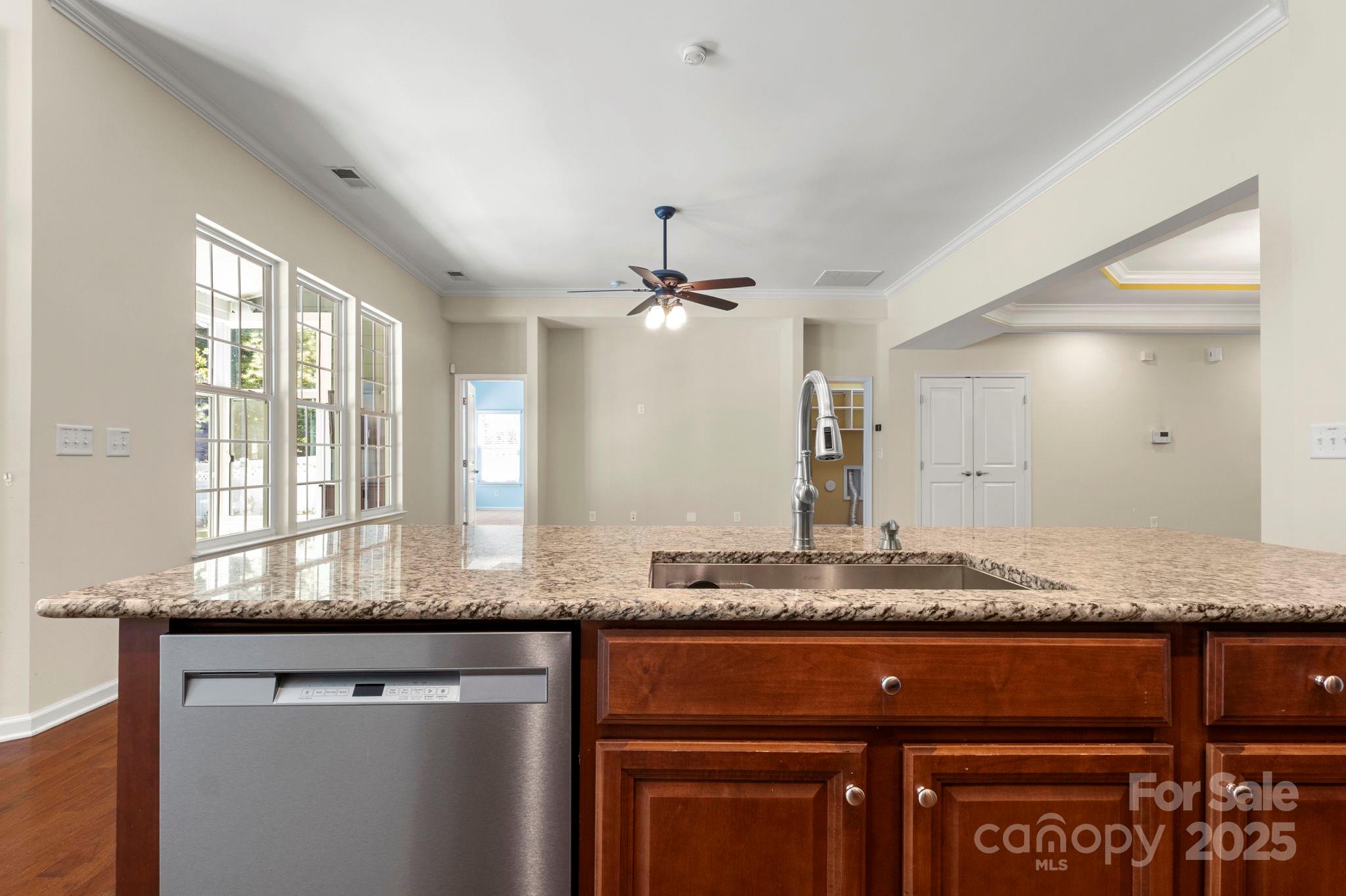 15709 Kiser Corner Lane Davidson, NC 28036 - Photo 15 of 42 a kitchen with granite countertop cabinets and window