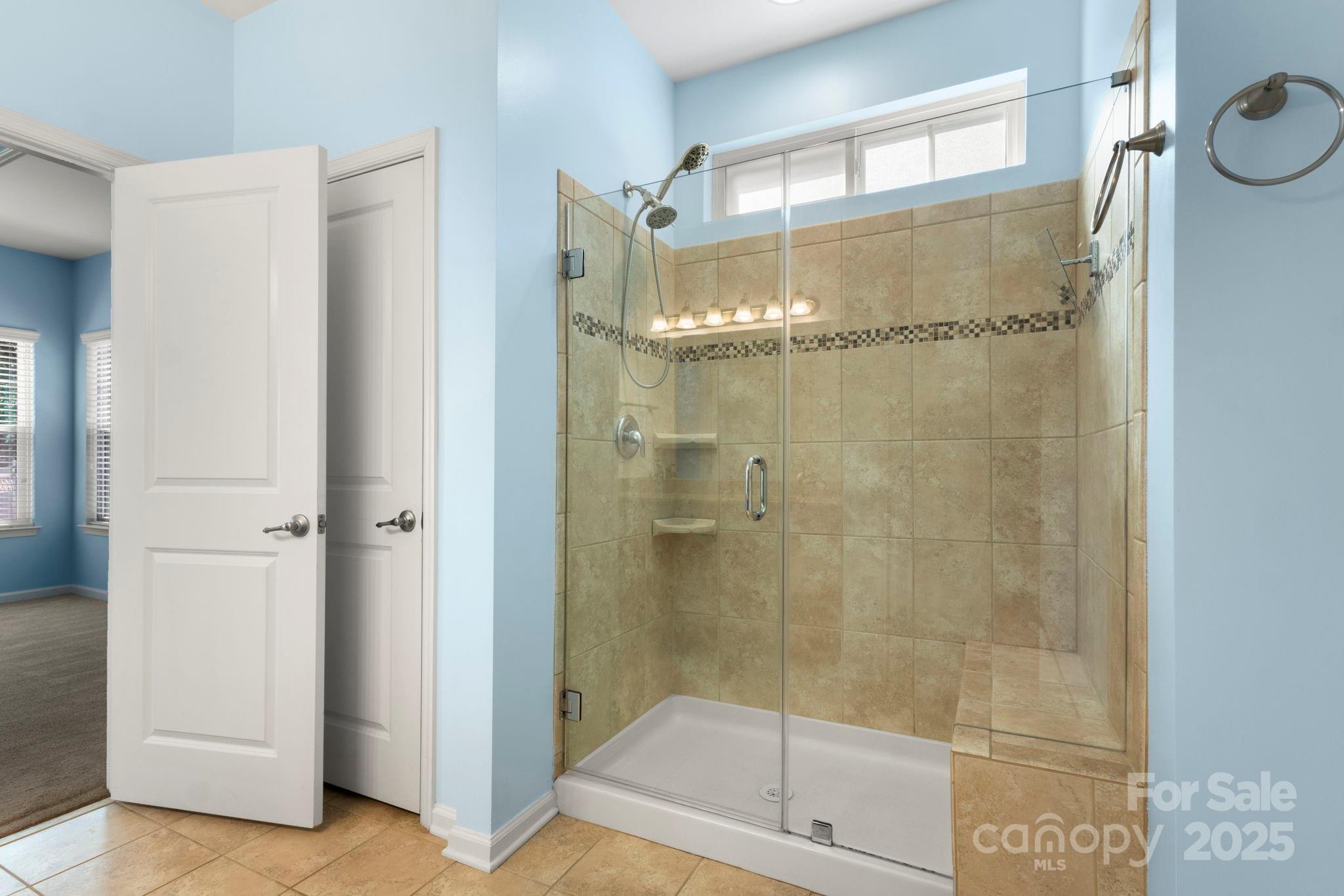 15709 Kiser Corner Lane Davidson, NC 28036 - Photo 19 of 42 a bathroom with a glass shower door