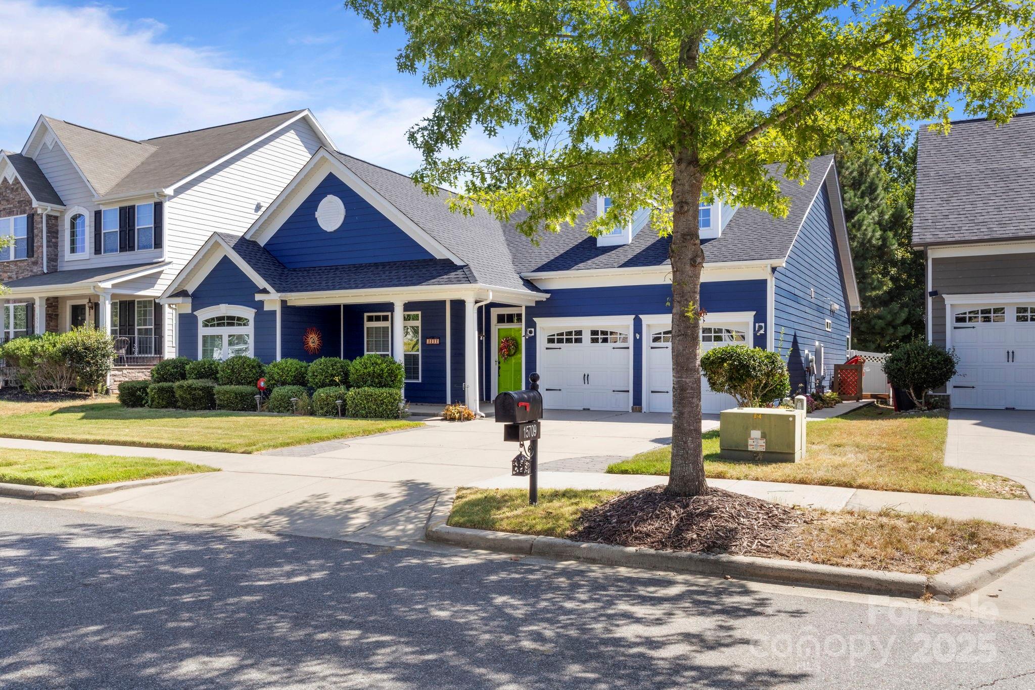 15709 Kiser Corner Lane Davidson, NC 28036 - Photo 2 of 42 a front view of a house with swimming pool and porch