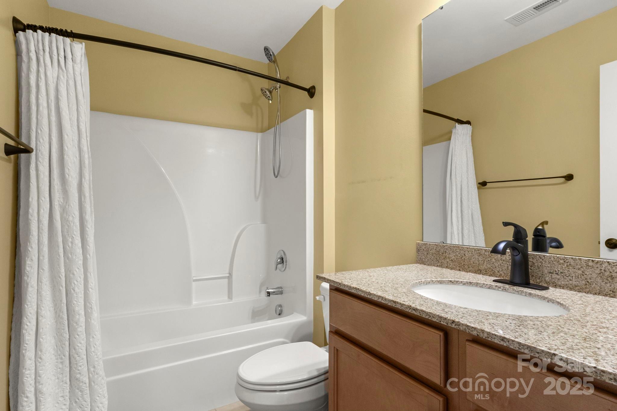 15709 Kiser Corner Lane Davidson, NC 28036 - Photo 25 of 42 a bathroom with a granite countertop sink toilet and shower