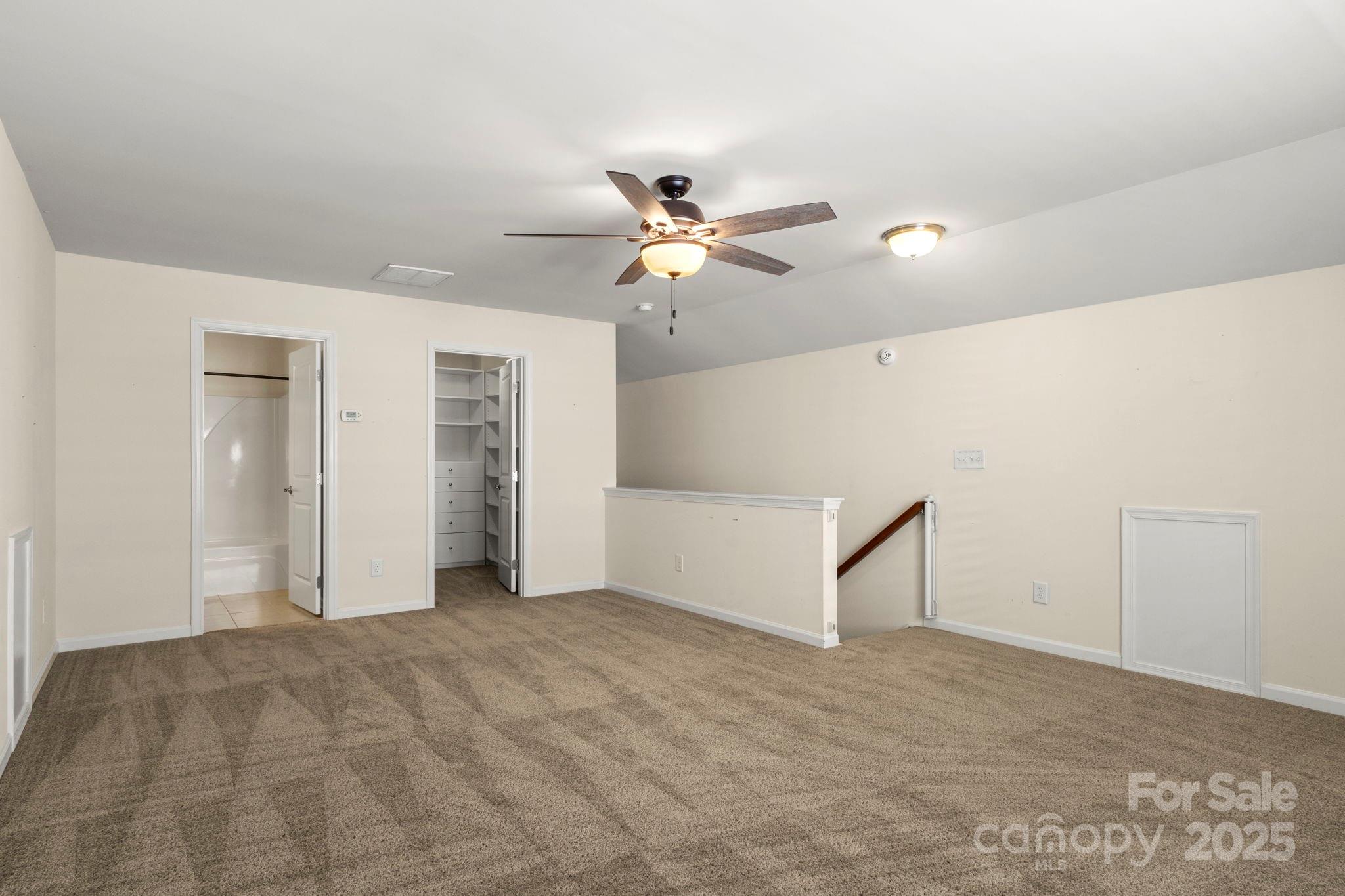 15709 Kiser Corner Lane Davidson, NC 28036 - Photo 30 of 42 a view of empty room with a ceiling fan