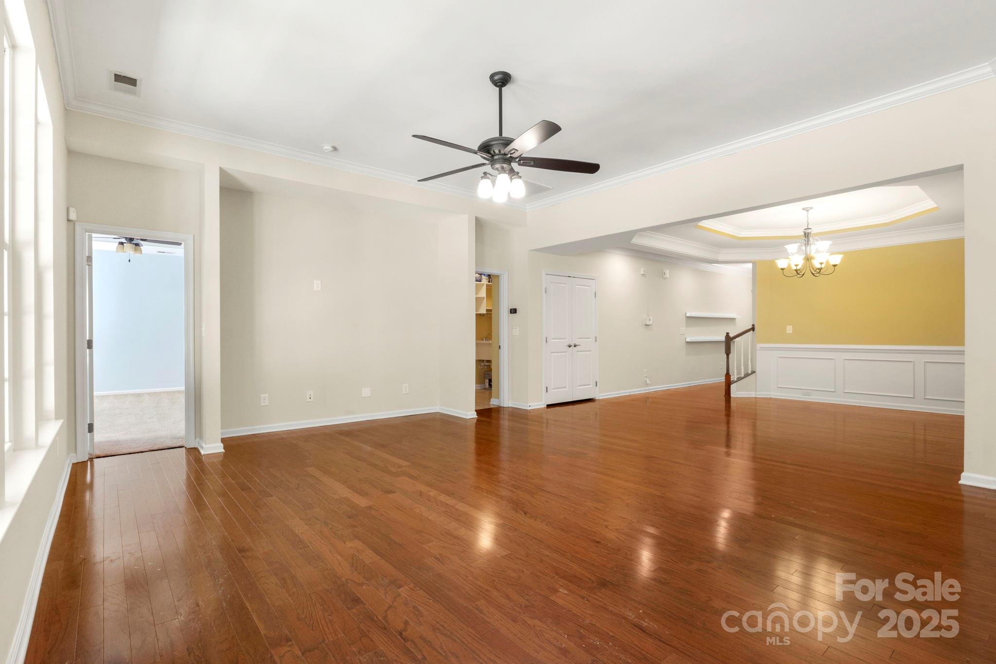 15709 Kiser Corner Lane Davidson, NC 28036 - Photo 7 of 42 a view of a livingroom with a ceiling fan and wooden floor
