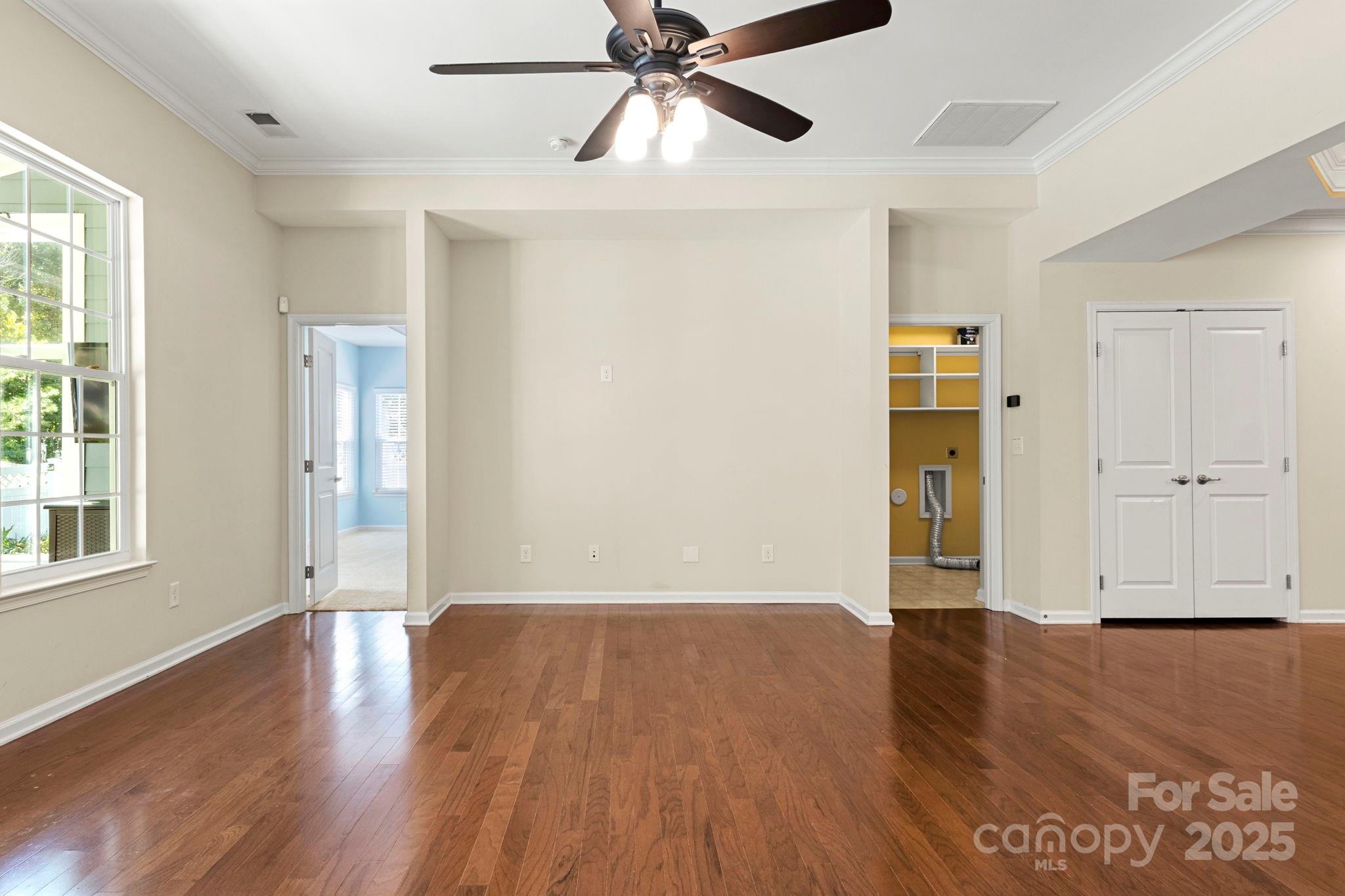 15709 Kiser Corner Lane Davidson, NC 28036 - Photo 9 of 42 a view of an empty room with wooden floor and a window