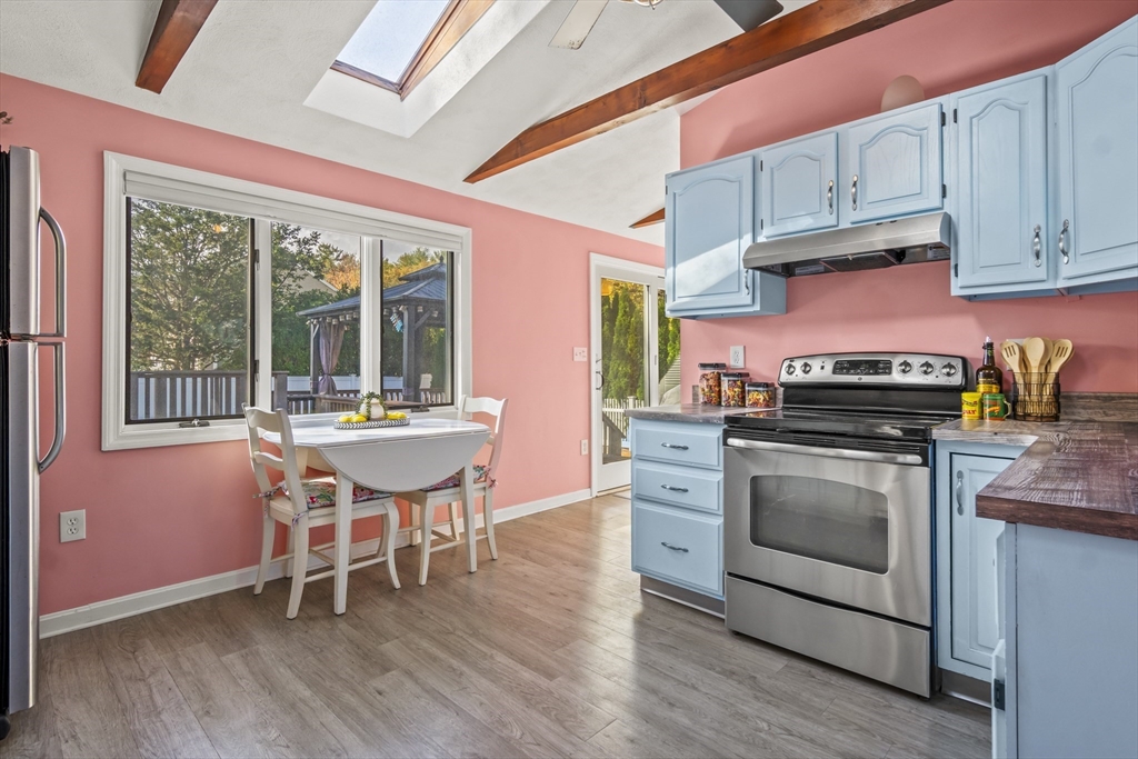 7 Allendale Avenue Billerica, MA 01821 - Photo 14 of 42 a kitchen with a stove a microwave and wooden floor