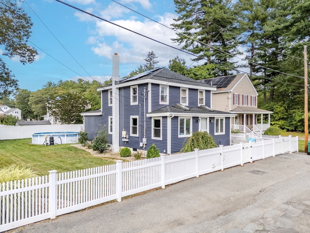 7 Allendale Avenue Billerica, MA 01821 - Photo 32 of 42 a view of a house with a small yard and wooden fence
