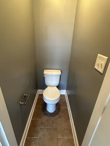 a bathroom with a toilet and a sink