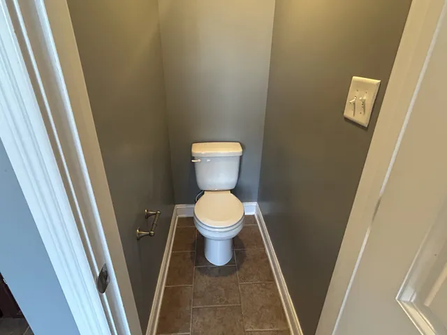 a view of empty room with wooden walls