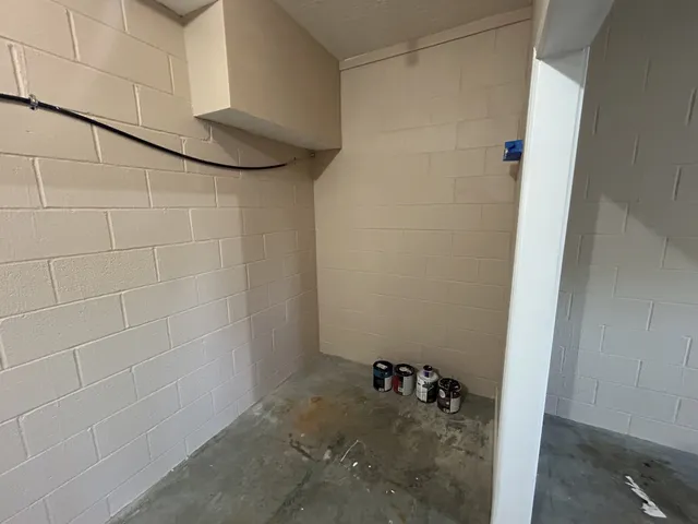 a view of a hallway with stairs