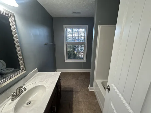 a view of entry way with wooden floor
