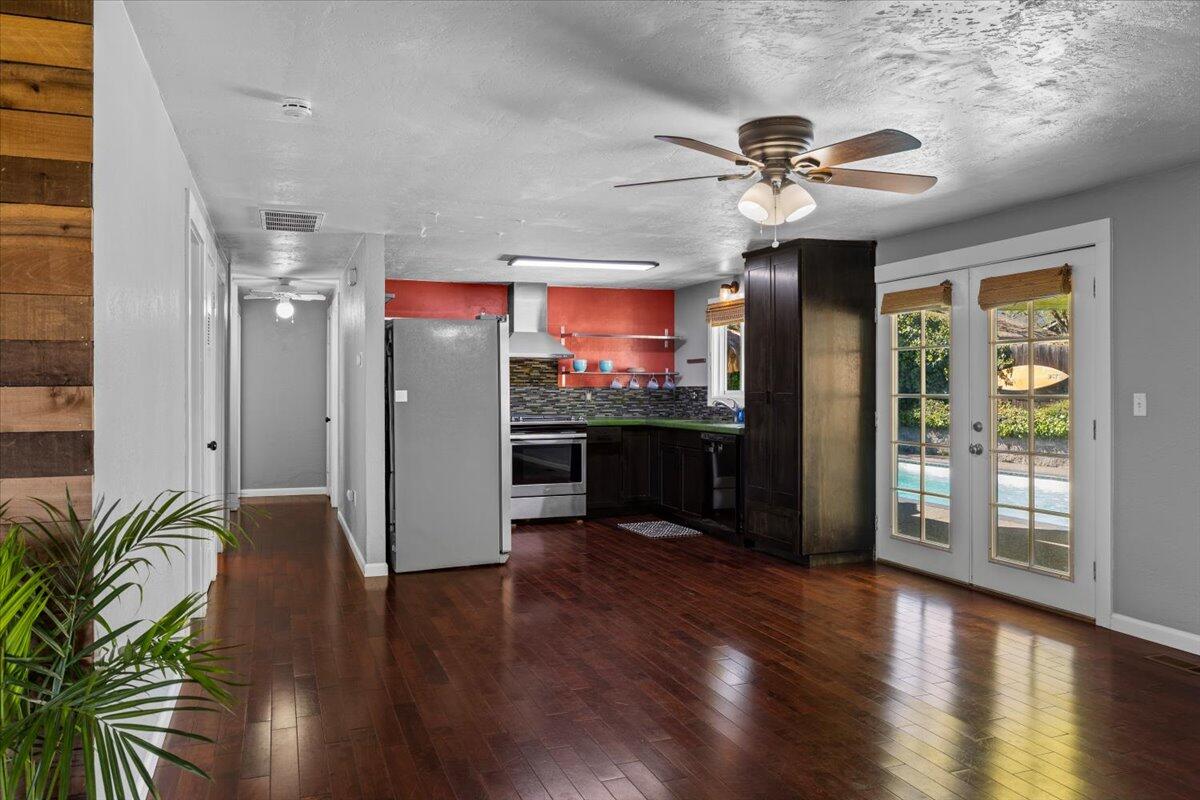 113 Houston Road Phoenix, OR 97535 - Photo 13 of 29 a view of a kitchen with a fridge and wooden floor