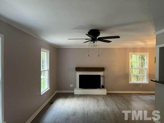 3600 Star Trek Court Raleigh, NC 27604 - Photo 12 of 25 a view of an empty room with wooden floor fireplace and a window